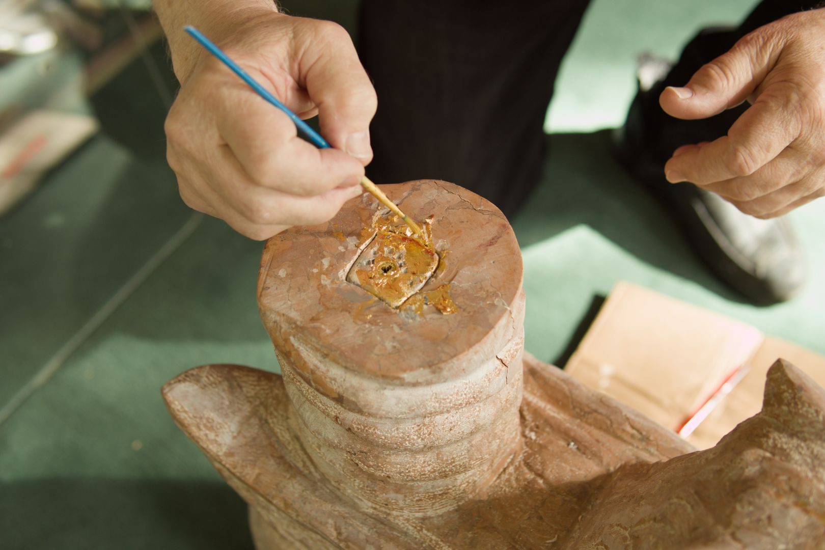 Gold leafing restoration detail